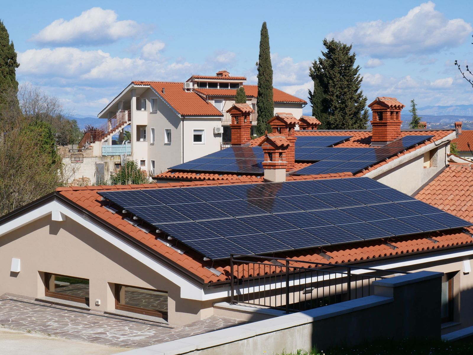 Suburban Missouri neighborhood with rooftop solar panels on a home